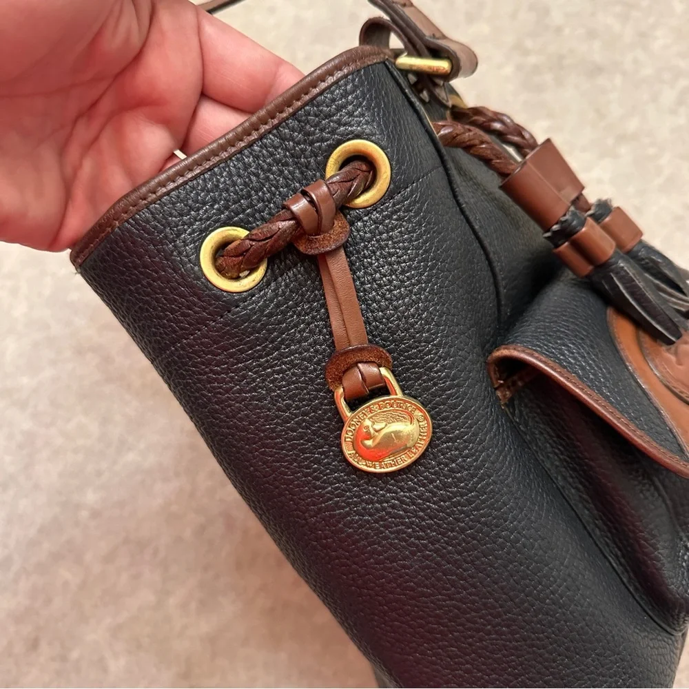 Vintage Dooney & Bourke Black w/Brown All Weather Leather Sling Small Backpack
